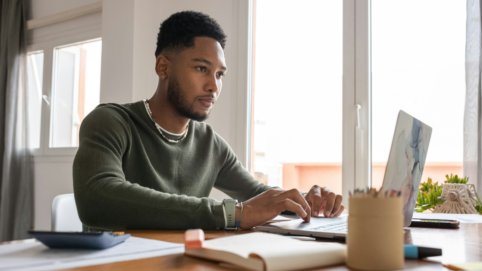 Man Studying ITIL On His Laptop