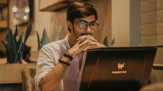 Man studying for an exam in a coffee shop.