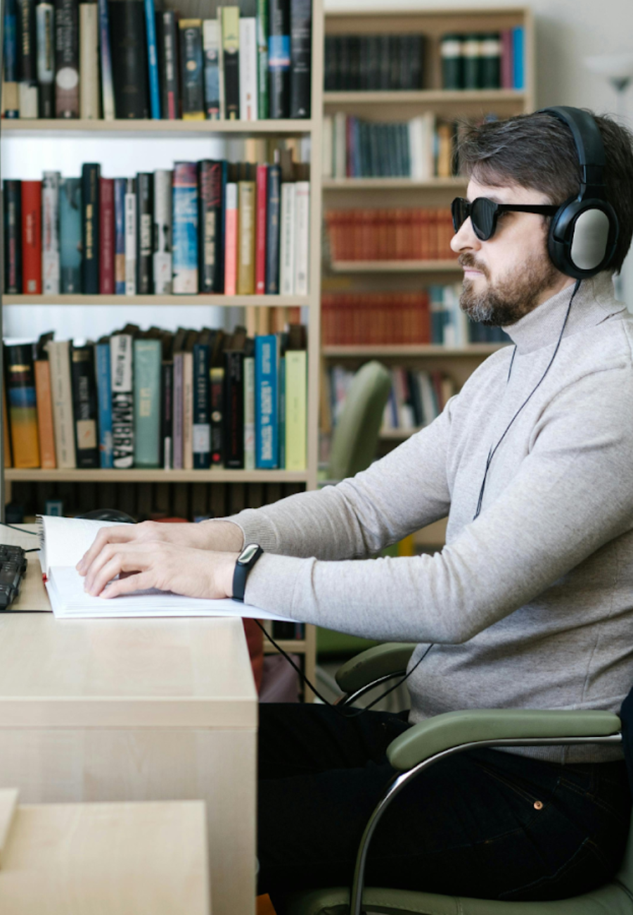 A Man Reviewing A Security+ Study Guide On His Computer